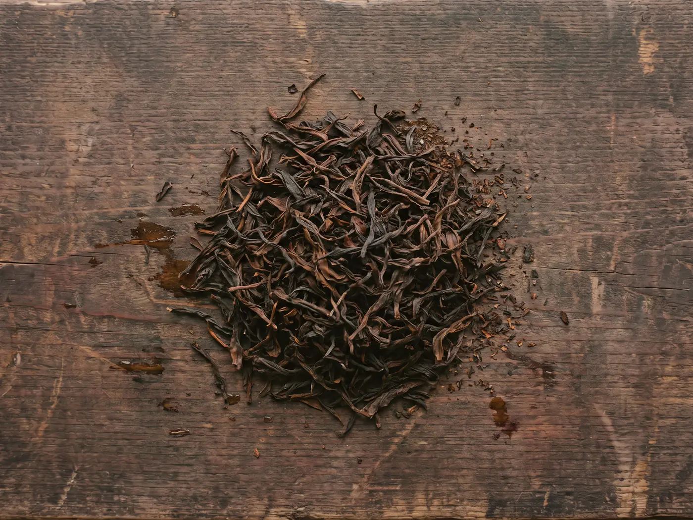 The finished tea, dark brown and dry.