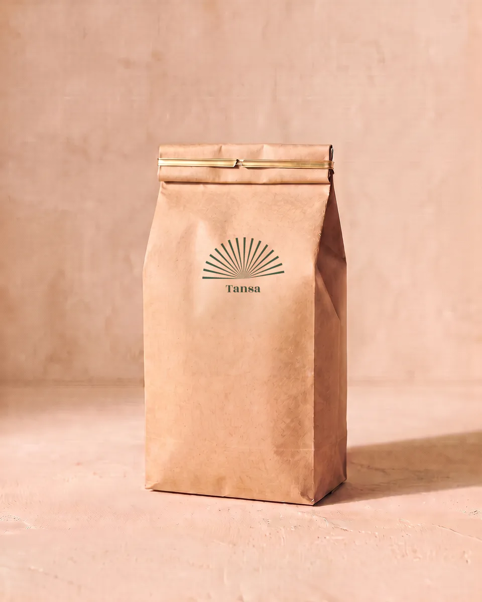 A kraft paper refill bag printed with a green sunburst.
